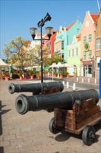 Historic anti-piracy cannons on Willemstaad harbour promenade