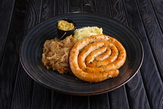 Homemade sausage with braised cabbage and mashed potato