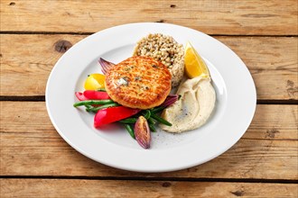 Salmon cutlet with roasted vegetables and green buckwheat
