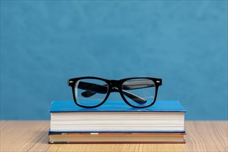 Front view books with glasses