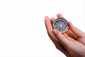 Isolated compass in child's hand on a white background