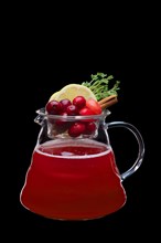 Apple and cranberry hot tea isolated on black. Healthy raw food concept. Photo with clipping path