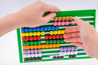 Hand using a color abacus