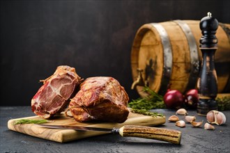 Air dried lamb neck meat on wooden cutting board