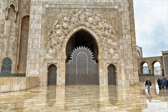 Pedestrians in the courtyard of the Hassan II Mosque
