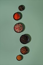 Overhead view of set of spice in metal bowls