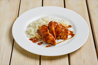 Baked chicken fillet with rice and barbecue sauce