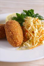 Chicken Kiev cutlet with pickled cabbage and mashed potato
