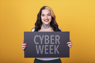 Beautiful woman holding a Cyber Week sign. Commercial concept. Commerce