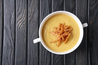 Top view of punpkin soup puree with chips