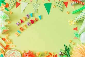 Happy birthday text with accessories green background