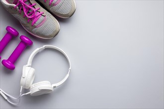 Top view pink sports attributes with headphones. Resolution and high quality beautiful photo