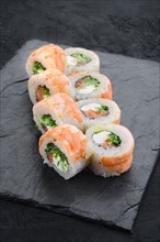 Rolls with shrimp and cream cheese on slate plate