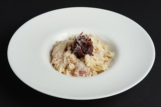 Plate of pasta with salmon and onion marmalade