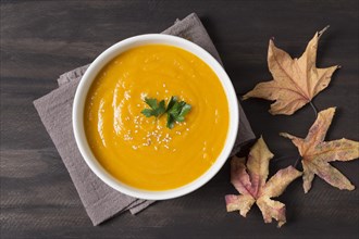 Top view cream soup and autumn leaves. Resolution and high quality beautiful photo