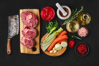 Overhead view of ingredients for preparation of ossobuco