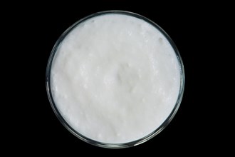 Top view of glass of smoothies isolated on black