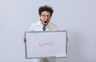 Scientist holds and points to a whiteboard with a mathematical formula. Scientist showing blackboard with mathematical equation