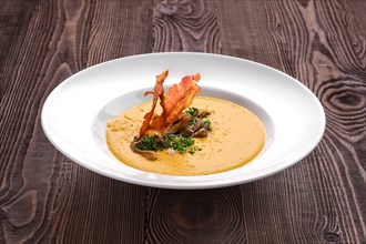 Mashed pumpkin soup puree with bacon