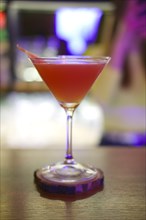 Soft focus photo of Brown Derby Cocktail. Image with shallow depth of field and contains a little noise due to poor lighting conditions