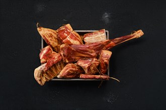 Assortment of air dried and smoked lamb and beef meat in wooden box
