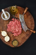 Making fresh raw pork mince meat with chopping knife