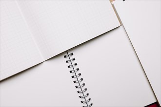 Opened notebooks with white pages