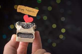 Valentine's day wording on torn typewriter as Love concept