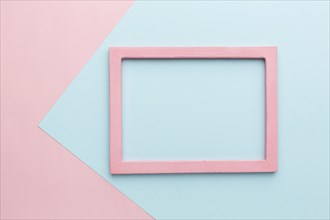 Flat lay beautiful pink wooden frame concept