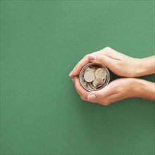 Person holding jar with coins with copy space. Resolution and high quality beautiful photo