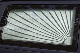 Car window with curtain on a hearse