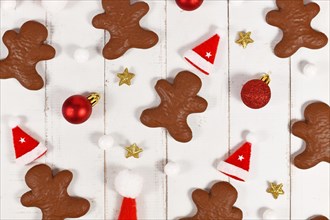 Chocolate glazed German gingerbread in shape of men between Christmas decoration