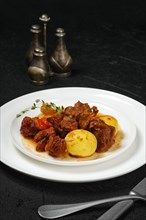 Lamb stew with potato on a plate