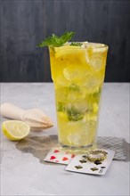 Faceted tall glass with cold citrus lemonade