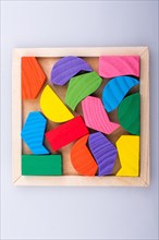 Colorful wooden pieces of a logic puzzle
