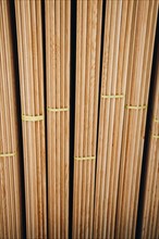 Large rectanguler wood panels stacked up together in display