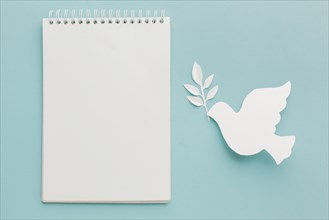 Top view of paper dove with notebook. Resolution and high quality beautiful photo
