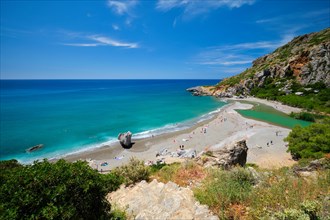 View of Preveli beach on Crete island with relaxing people and Mediterranean sea. Crete island