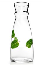 Empty transparent jug with mint leaf