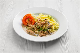Plate with chicken goulash