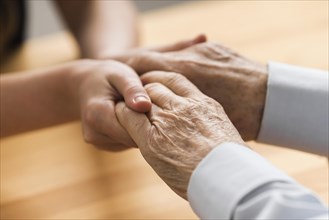 Nurse holding senior man s hands empathy. Resolution and high quality beautiful photo