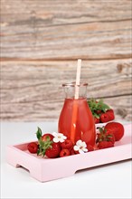 Homemade strawberry and raspberry fruit lemonade in jar