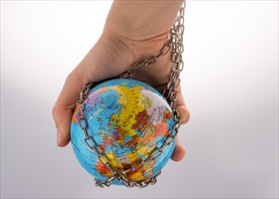Globe in chain on a white background