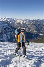 Ski tourer in winter in the snow