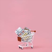 Front view shopping cart with pill foils copy space