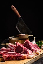 Selective focus photo of fresh raw rack of lamb on cutting board