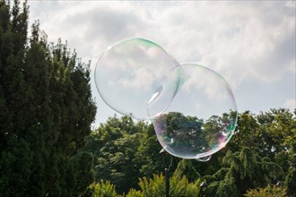 Blown soap bubbles float in air in view