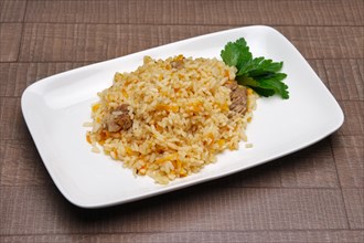 Portion of pilaf on square plate