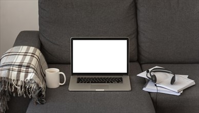Laptop headset home sofa during quarantine