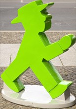 The figure of the green eastern traffic light man Galoppo by Karl Peglau in front of a souvenir shop at the Gendarmenmarkt